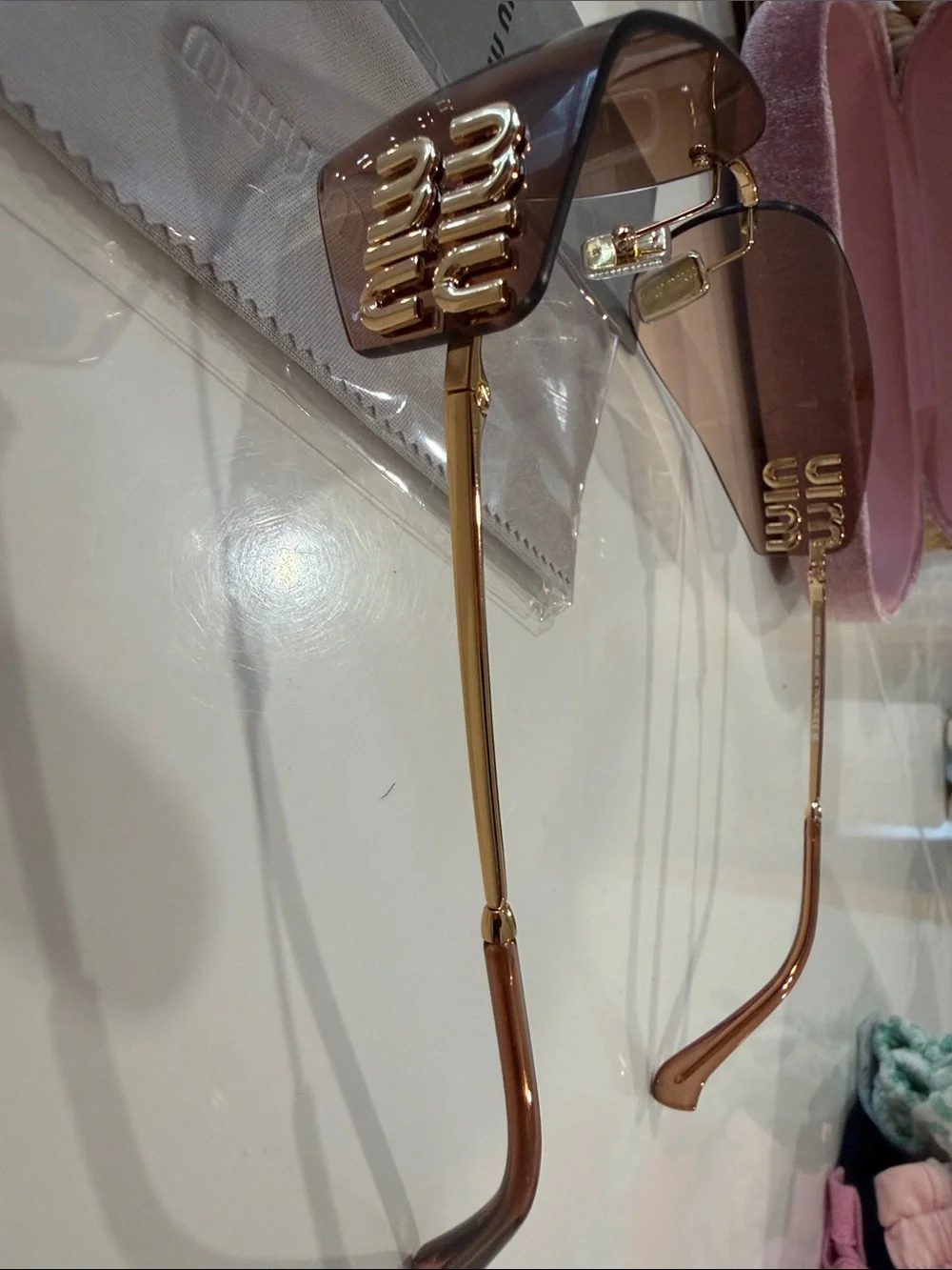 Miu Miu Brown Rimless Sunglasses with Gold Bridge